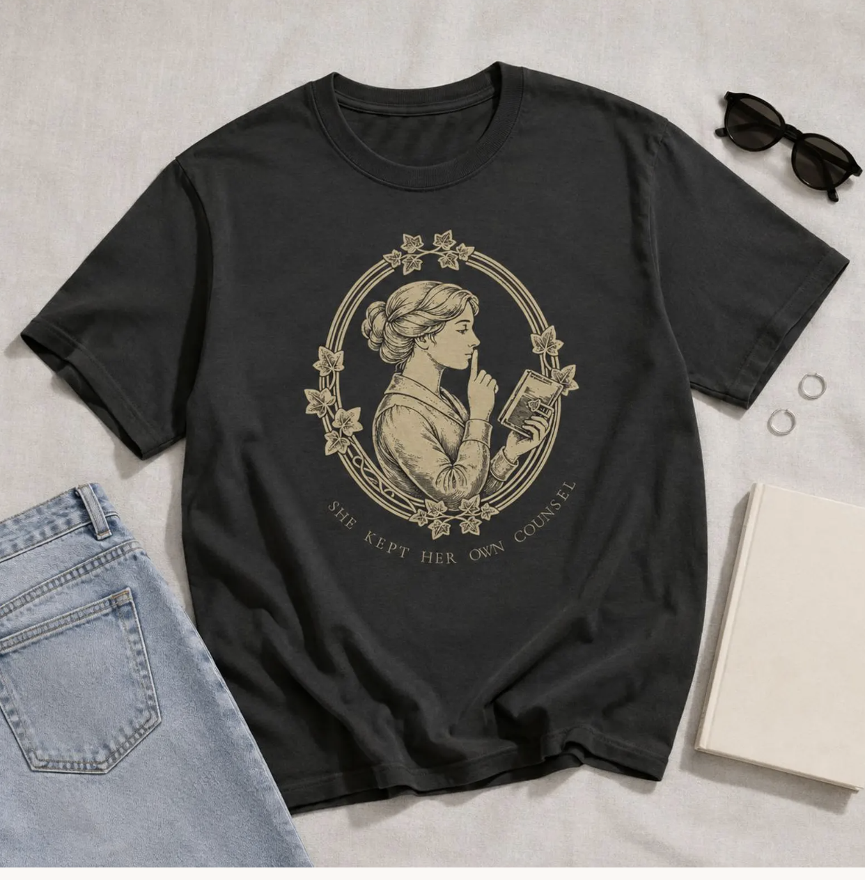 She Kept Her Own Counsel black shirt flat-lay by Bookplate & Co.